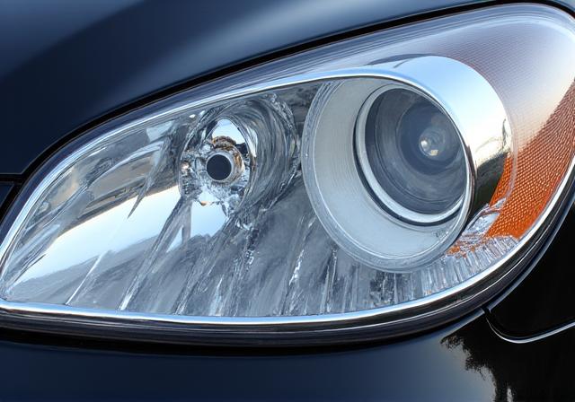 Before and after of a yellowed, hazy headlight. After shows a crystal-clear, restored headlight.